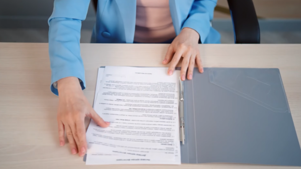 woman with documents on the desk