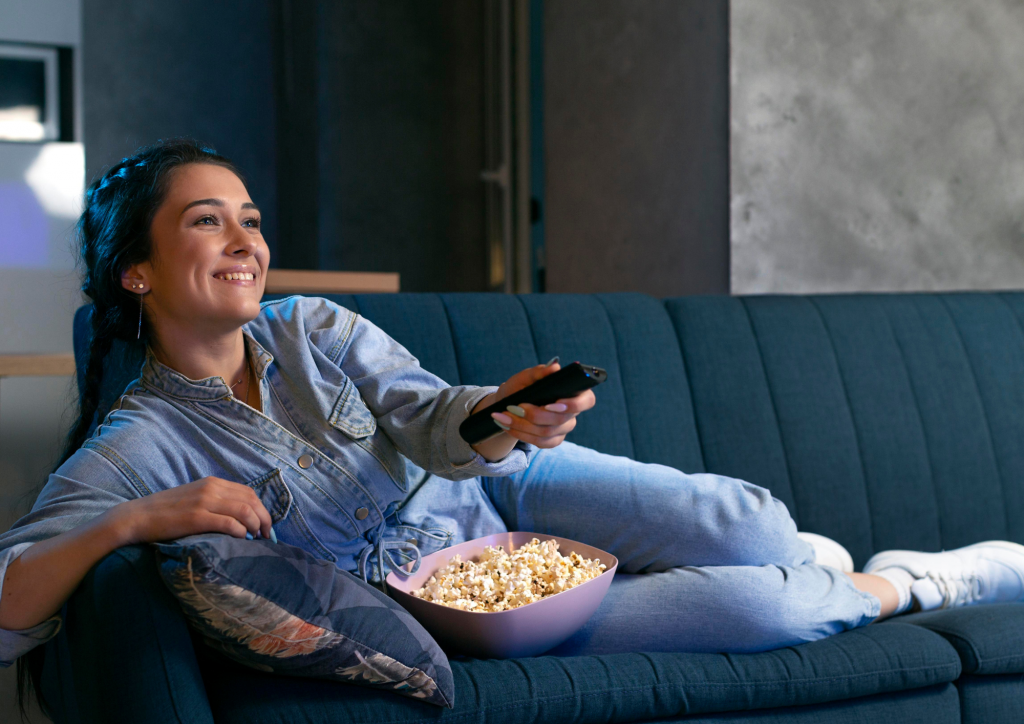 girl watching movie-popcorns-tv-movies streaming service-home